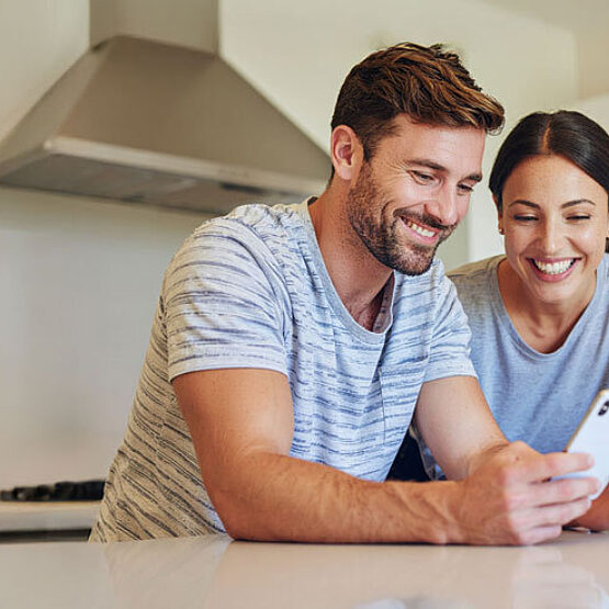 Crop Firefly Homeowner couple looking at social media home improvement DIY videos together on a ph 676706