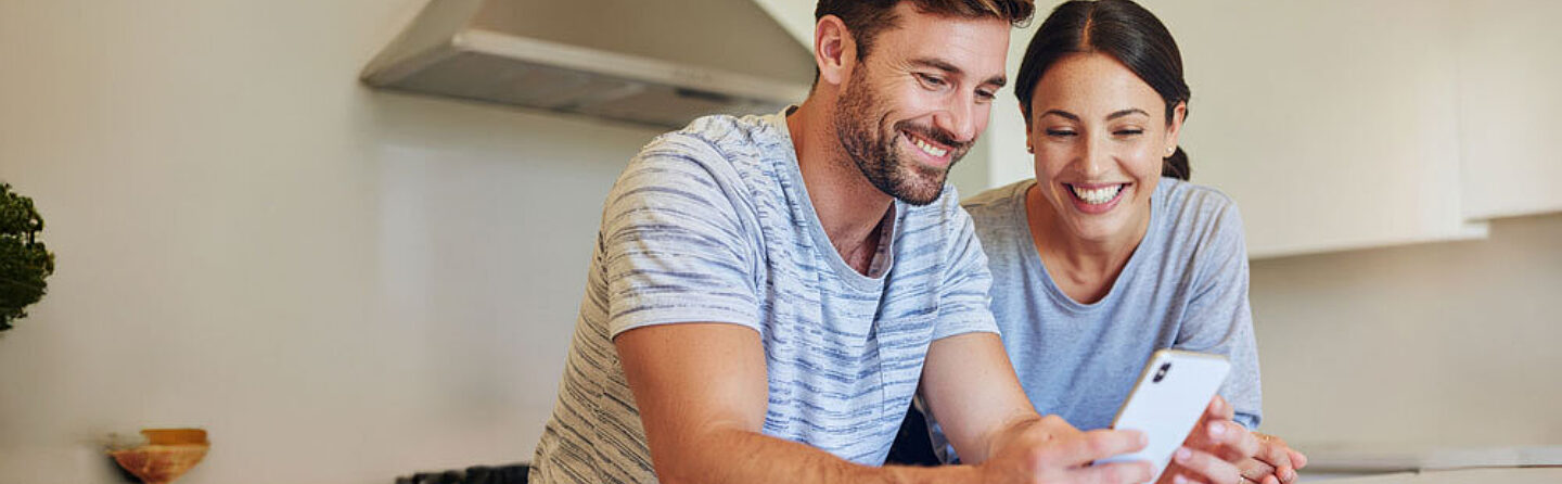 Crop Firefly Homeowner couple looking at social media home improvement DIY videos together on a ph 676706